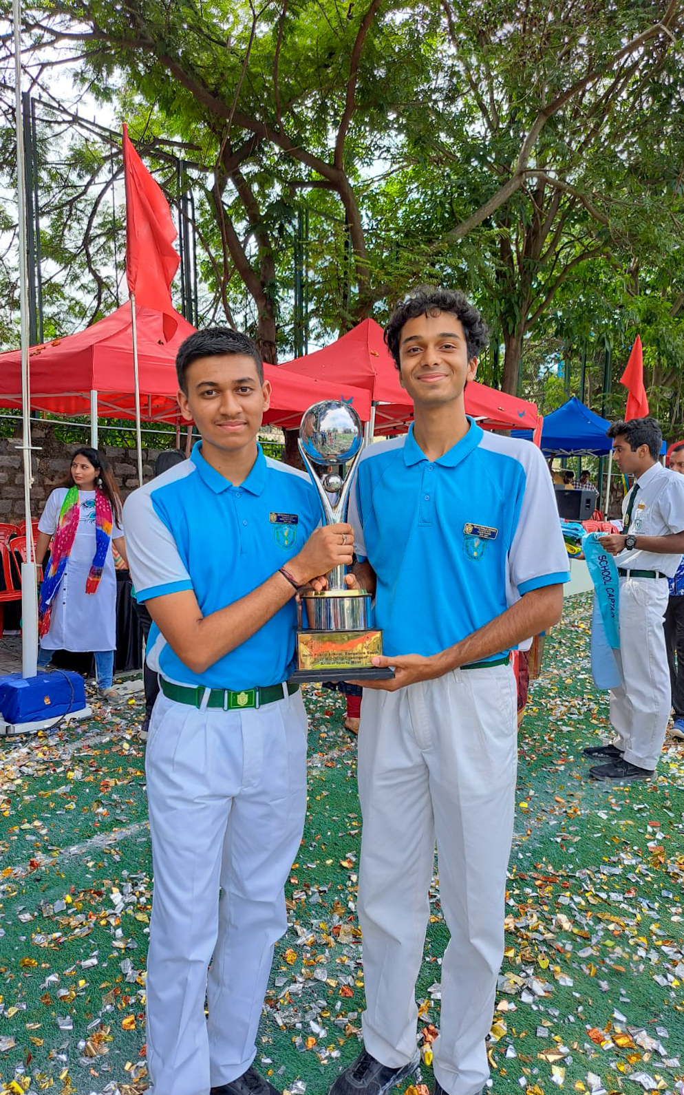 With captain holding trophy